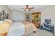 Bedroom with closet doors, painted hutch and iron bed at 4700 Mainsail Dr, Bradenton, FL 34208