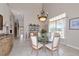 Formal dining room featuring an elegant chandelier and large window at 4700 Mainsail Dr, Bradenton, FL 34208