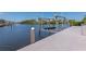 Waterfront dock with boat lift, showcasing canal views and providing easy access to boating activities at 4700 Mainsail Dr, Bradenton, FL 34208