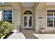 Elegant front entrance with double doors and decorative accents enhancing curb appeal at 4700 Mainsail Dr, Bradenton, FL 34208
