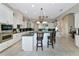 Beautiful kitchen featuring white cabinetry, granite countertops, and a large center island at 4700 Mainsail Dr, Bradenton, FL 34208