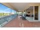 Expansive screened lanai with rocking chairs, offering stunning views, perfect for relaxing and enjoying the scenery at 4700 Mainsail Dr, Bradenton, FL 34208
