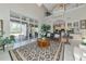 An open concept living room with high ceilings, lots of natural light and tile floors at 4700 Mainsail Dr, Bradenton, FL 34208