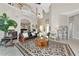 An open concept living room with high ceilings, lots of natural light and tile floors at 4700 Mainsail Dr, Bradenton, FL 34208