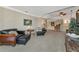 Spacious living room featuring elegant furnishings, connecting to a wet bar area, perfect for relaxing and entertaining at 4700 Mainsail Dr, Bradenton, FL 34208