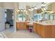 Vanity area with dual sinks and lots of natural lighting at 4700 Mainsail Dr, Bradenton, FL 34208
