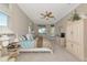 Spacious main bedroom featuring a ceiling fan and a private outdoor entry at 4700 Mainsail Dr, Bradenton, FL 34208