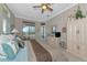 Spacious main bedroom featuring a ceiling fan and a private outdoor entry at 4700 Mainsail Dr, Bradenton, FL 34208