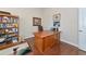 Office with wood desk, shelves and hardwood flooring at 4700 Mainsail Dr, Bradenton, FL 34208