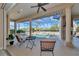 Covered patio featuring a seating area overlooking the pool and backyard at 4700 Mainsail Dr, Bradenton, FL 34208