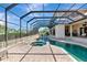 An exterior pool area with spa, covered structure, and views of the surrounding landscape at 4700 Mainsail Dr, Bradenton, FL 34208