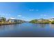 Scenic waterfront view showcasing the canal with well-maintained docks and charming waterfront homes at 4700 Mainsail Dr, Bradenton, FL 34208