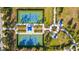 Aerial view of community tennis courts, walkways, and common areas with mature landscaping at 4734 Claremont Park Dr, Bradenton, FL 34211