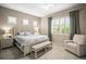 Bedroom featuring a queen bed, white furniture, shutters, and a ceiling fan at 4734 Claremont Park Dr, Bradenton, FL 34211