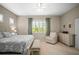 Bedroom featuring a queen bed, white furniture, shutters, and a ceiling fan at 4734 Claremont Park Dr, Bradenton, FL 34211
