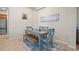 Charming dining area featuring rustic wooden table and seating, complemented by stylish decor at 4734 Claremont Park Dr, Bradenton, FL 34211
