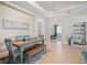 Bright and inviting dining space featuring a rustic table, comfortable seating, and modern decor at 4734 Claremont Park Dr, Bradenton, FL 34211