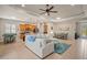 Open-concept living room seamlessly connects the kitchen and dining areas, perfect for entertaining at 4734 Claremont Park Dr, Bradenton, FL 34211