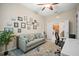 Home office with modern desk setup, comfy sofa, and framed photos on wall for decor at 4734 Claremont Park Dr, Bradenton, FL 34211