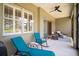 Relaxing screened-in patio features seating, ceiling fan, and view of the landscaped backyard at 4734 Claremont Park Dr, Bradenton, FL 34211