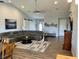 Bright living room with vaulted ceilings, hardwood floors, stylish decor, and a comfortable sectional sofa at 48 Lark Dr, Placida, FL 33946