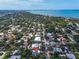 Expansive aerial view of a neighborhood near the water, showcasing lush greenery and a serene coastal setting at 5012 Eastchester Dr, Sarasota, FL 34234