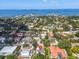 Aerial view of home in established neighborhood with water views at 5012 Eastchester Dr, Sarasota, FL 34234