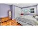 Bedroom featuring hardwood floors, natural light and a chest of drawers at 5012 Eastchester Dr, Sarasota, FL 34234