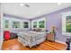 Bedroom with hardwood floors and large windows offering plenty of natural light at 5012 Eastchester Dr, Sarasota, FL 34234