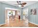 Charming dining room with hardwood floors and views into the kitchen, creating a seamless flow at 5012 Eastchester Dr, Sarasota, FL 34234