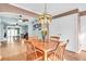 Dining room with hardwood floors open to a living room with lots of natural light at 5012 Eastchester Dr, Sarasota, FL 34234
