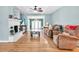 Cozy living room featuring a fireplace, hardwood floors, and comfortable seating area at 5012 Eastchester Dr, Sarasota, FL 34234