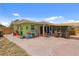 The property features a large backyard with a patio, great for outdoor entertaining and recreation at 5353 Starwood Pl, Sarasota, FL 34232