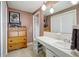 Bathroom featuring ample counterspace, storage, and a neutral color palette at 5353 Starwood Pl, Sarasota, FL 34232
