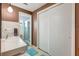 Well-lit bathroom with a single sink, updated vanity, and enclosed shower at 5353 Starwood Pl, Sarasota, FL 34232