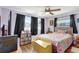 Cozy bedroom with colorful accents, ceiling fan, and lots of natural light at 5353 Starwood Pl, Sarasota, FL 34232