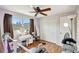 Bedroom featuring laminate floors, ceiling fan, storage, and decor at 5353 Starwood Pl, Sarasota, FL 34232