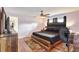 Stylish bedroom featuring warm lighting and wooden furniture, creating a relaxing atmosphere at 5353 Starwood Pl, Sarasota, FL 34232