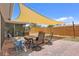 A backyard patio featuring a table and chairs, providing an inviting space for outdoor relaxation and entertaining at 5353 Starwood Pl, Sarasota, FL 34232