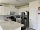 Well-equipped kitchen boasts stainless steel appliances, ample cabinet space, and quartz countertops at 5521 Summit Gln, Bradenton, FL 34203