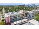 Stunning aerial view of multi-story building showcasing colorful architecture and a vibrant urban landscape at 555 N Orange Ave # 307, Sarasota, FL 34236