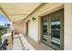 Covered balcony with green doors and outdoor lights, offering a scenic view at 555 N Orange Ave # 307, Sarasota, FL 34236