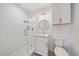 This bathroom features a vanity with white cabinets, a shower with glass doors and tile walls at 555 N Orange Ave # 307, Sarasota, FL 34236
