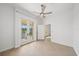 Light-filled bedroom features wood-look tile floors and a private balcony at 555 N Orange Ave # 307, Sarasota, FL 34236