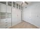 This bedroom features wood floors, a closet and a built-in Murphy bed with shelving at 555 N Orange Ave # 307, Sarasota, FL 34236
