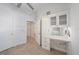 This bedroom features wood floors and a built-in vanity with upper cabinets at 555 N Orange Ave # 307, Sarasota, FL 34236