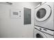 This laundry room shows a stacked Samsung washer and dryer and utility panels at 555 N Orange Ave # 307, Sarasota, FL 34236