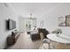 Bright living room with modern decor, wood floors, and a balcony, perfect for relaxing and entertaining at 555 N Orange Ave # 307, Sarasota, FL 34236