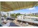 Balcony view overlooking a parking lot with covered parking and a city skyline backdrop at 555 N Orange Ave # 307, Sarasota, FL 34236