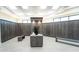 Clean and organized locker room with wooden lockers, ample storage space, and modern amenities at 5685 Palmer Cir # 204, Lakewood Ranch, FL 34211